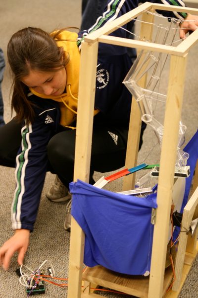Nicole Tomita performs some adjustments
