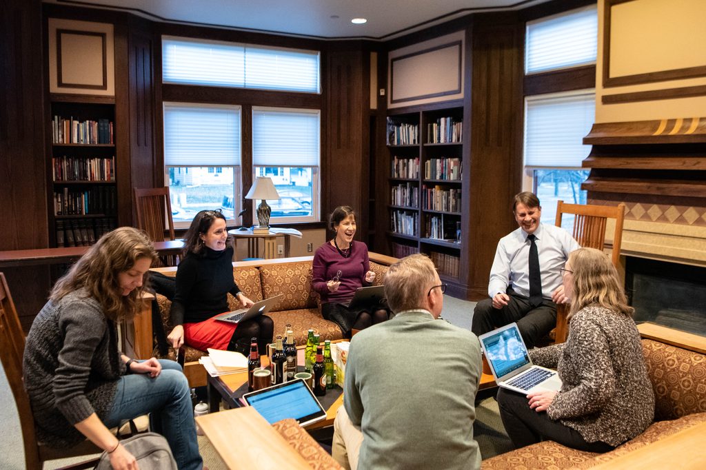 Members of the 2019-20 Humanities Center Faculty Research Seminar meeting in the AGH library