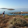 The Small Cycladic Islands Project Field Season 2019. Two people survey an island, with several other islands in the distance