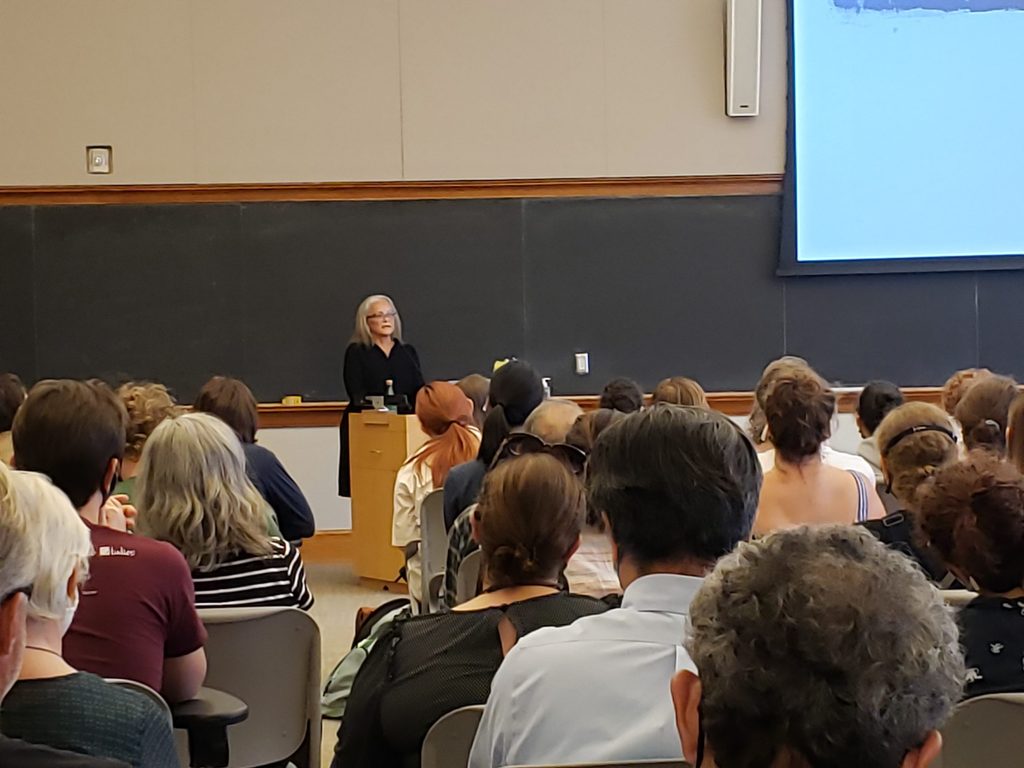 Gwen Westerman stands in front of an audience while presenting her keynote address