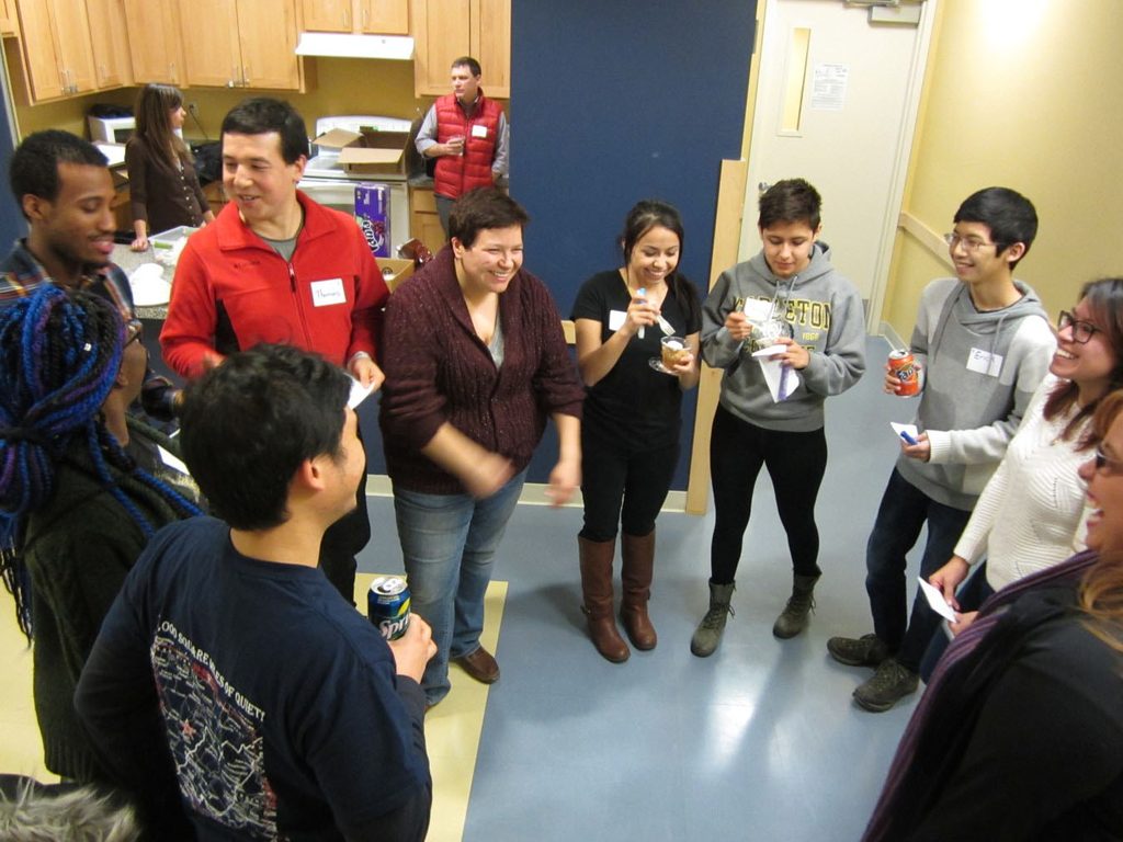 Students & staff participating in a discussion at Class Act