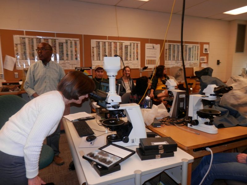 Ann May getting a close look at a rock slide while visiting Professor of Geology, Bereket Haileab's class.
