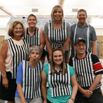 NOlympic Referees: 7 people in the photo wearing black and white referee vests