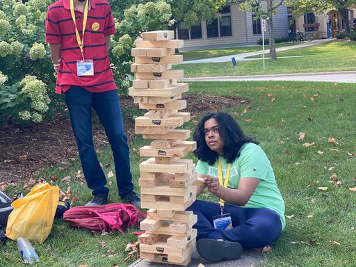 2025 students strategize their giant jenga gameplay.