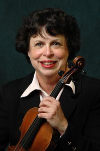 Mary Horozaniecki holding a violin