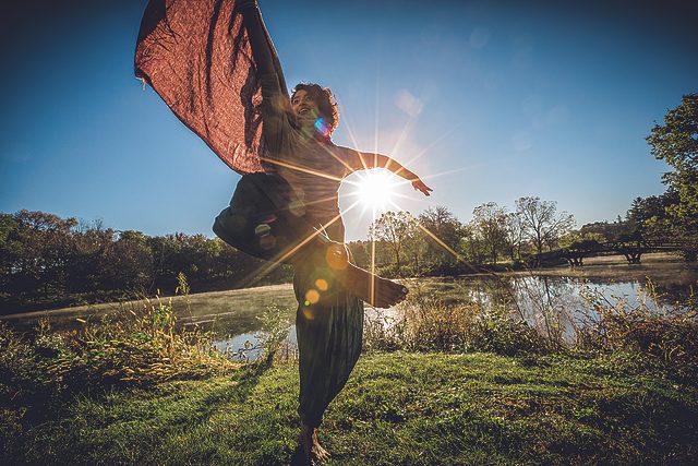 ​Ann Treesa Joy twirls barefoot in the grass on Stewsie Island