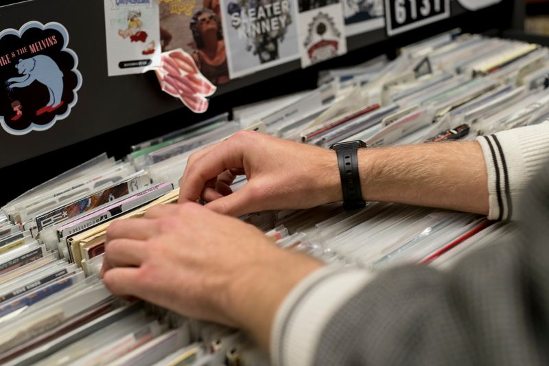 A DJ thumbs through albums at KRLX radio station