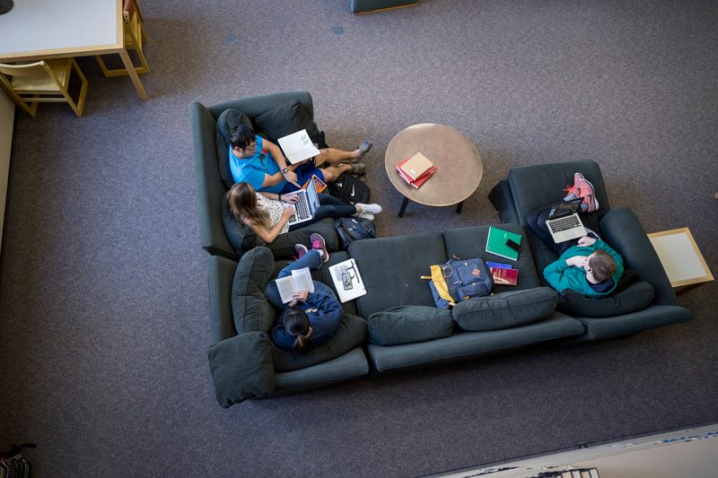 People gather on couches at the Libe.