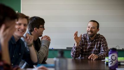 <p>A professor leads a lively classroom discussion</p>