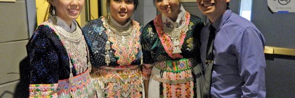 Four members of the Coalition of Hmong Students, three in traditional dresses