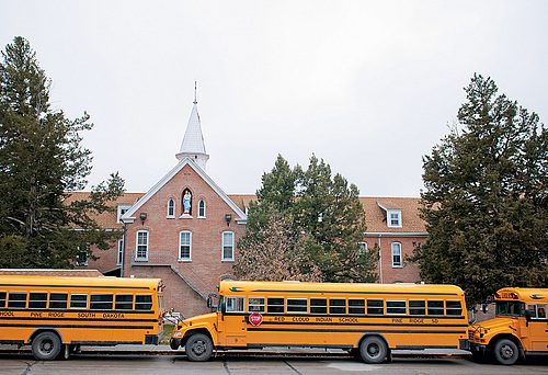 School buses lined up outside Red Cloud School.