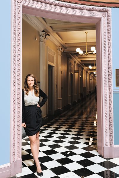 Grace Strome '11 poses at the entrance of a White House hallway.