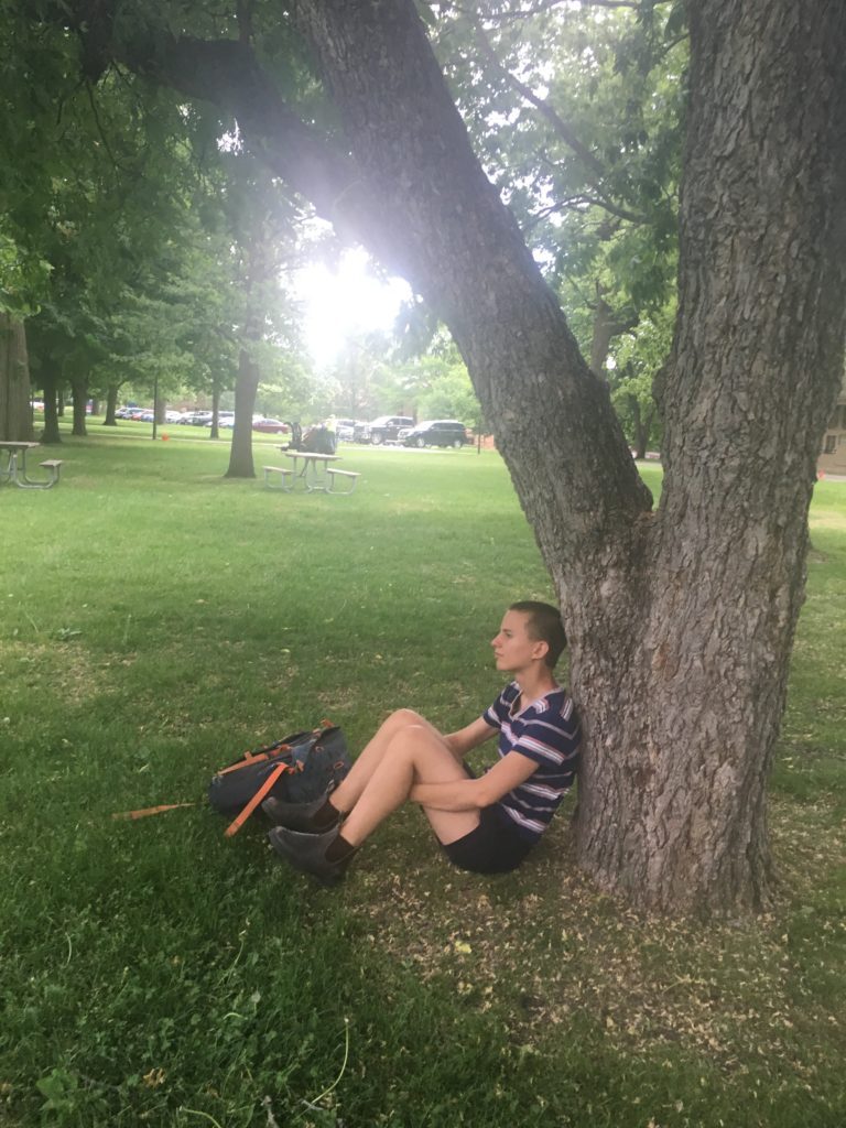 Sitting by a tree
