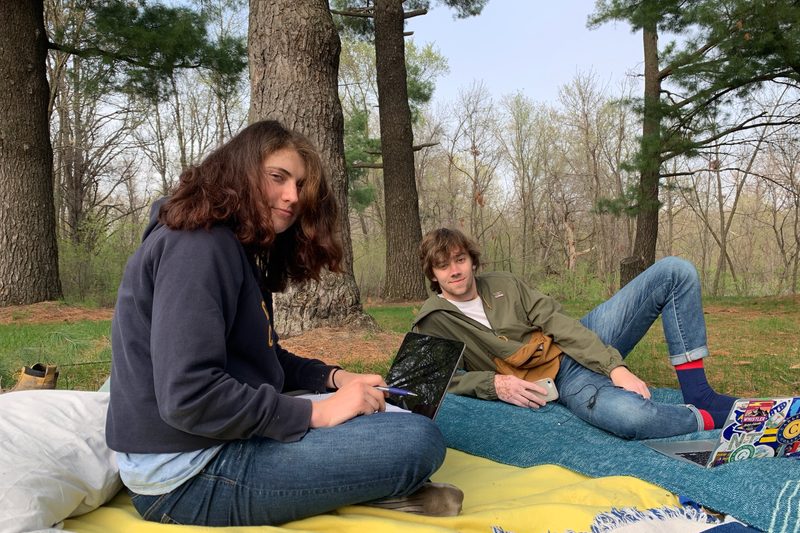 A picture of Lucas' friends Sonya and Jack on blankets in the arb