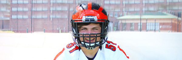 A young man wearing a football uniform