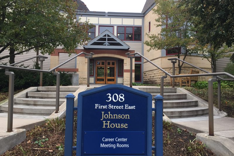 Front door of a building with sign reads "Johnson House"