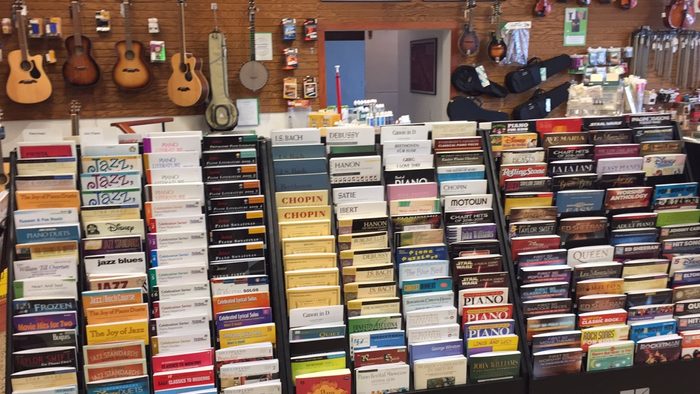 A shelf of sheet music in a music store