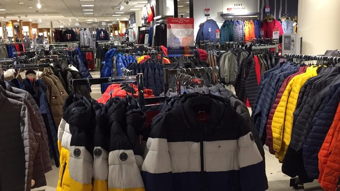 Rows of winter jackets in a store
