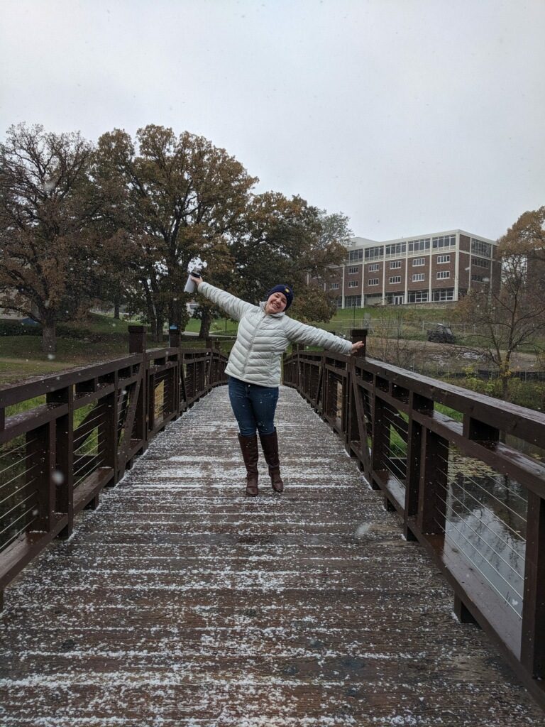 girl on bridge in snow