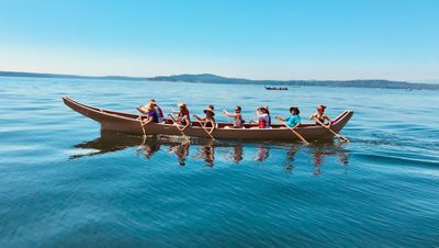 Canoe Journey. Canoe on water as with people paddling.