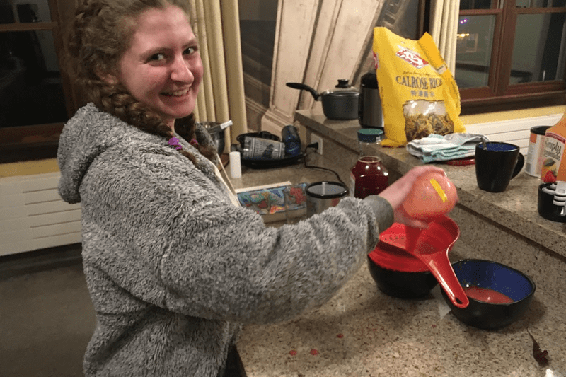 Student cooking in Evans