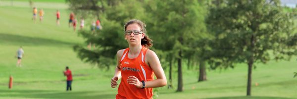 A picture of a carleton student running