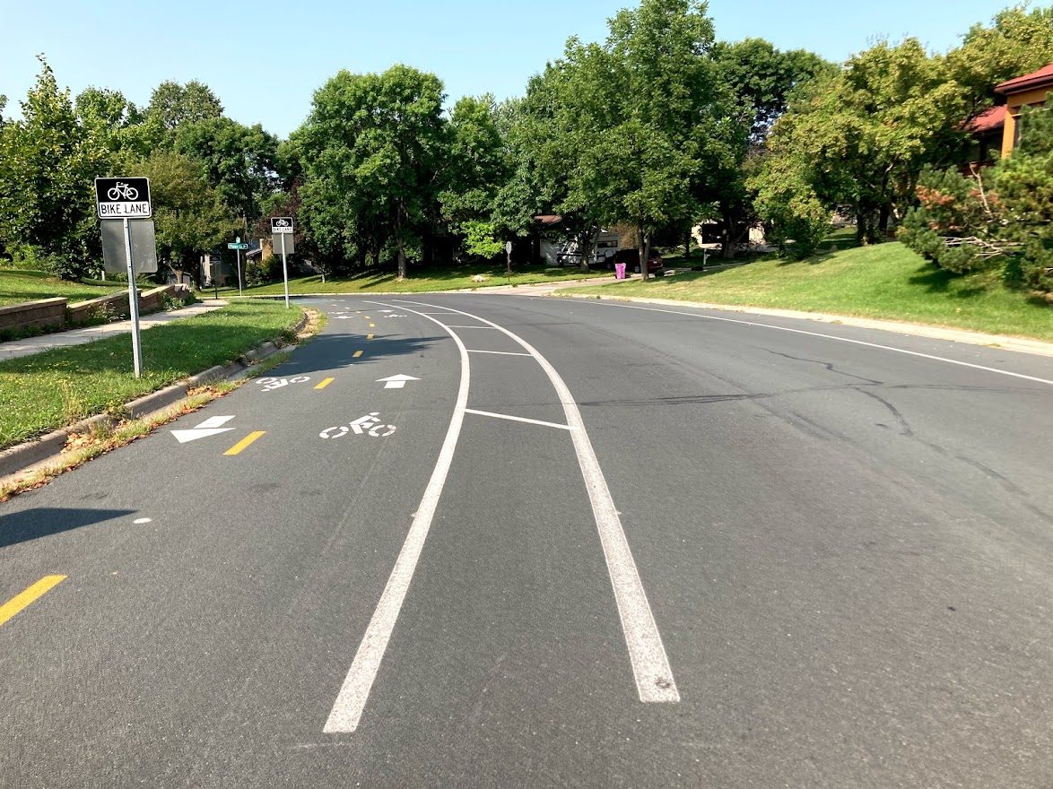 A neighborhood road with designated bike lanes