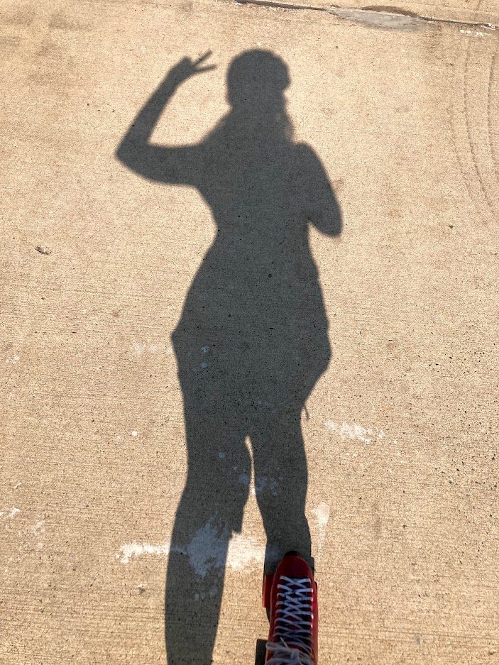 A shadow of McKenna on rollerskates