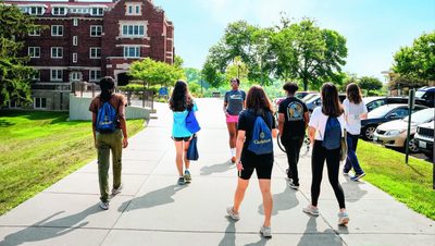 A Carleton student (Jancyn) giving a tour to prospective students