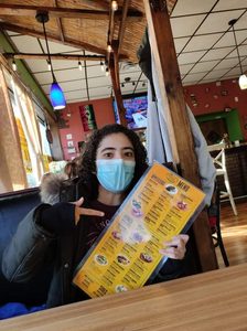 Me showing off our menu in Spanish!
