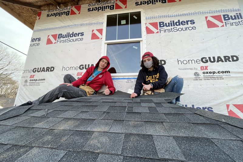 Josh and I on the roof installing shingles.