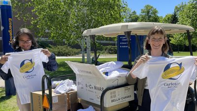 President Byerly and Dean Livingston hand out April Fools logo shirts