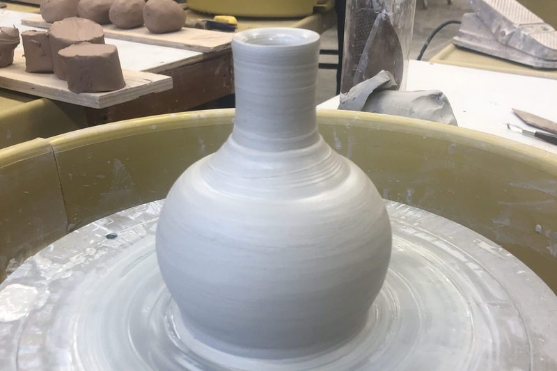 Wet vase, newly thrown on the potter's wheel