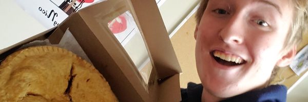 selfie of man holding a pie
