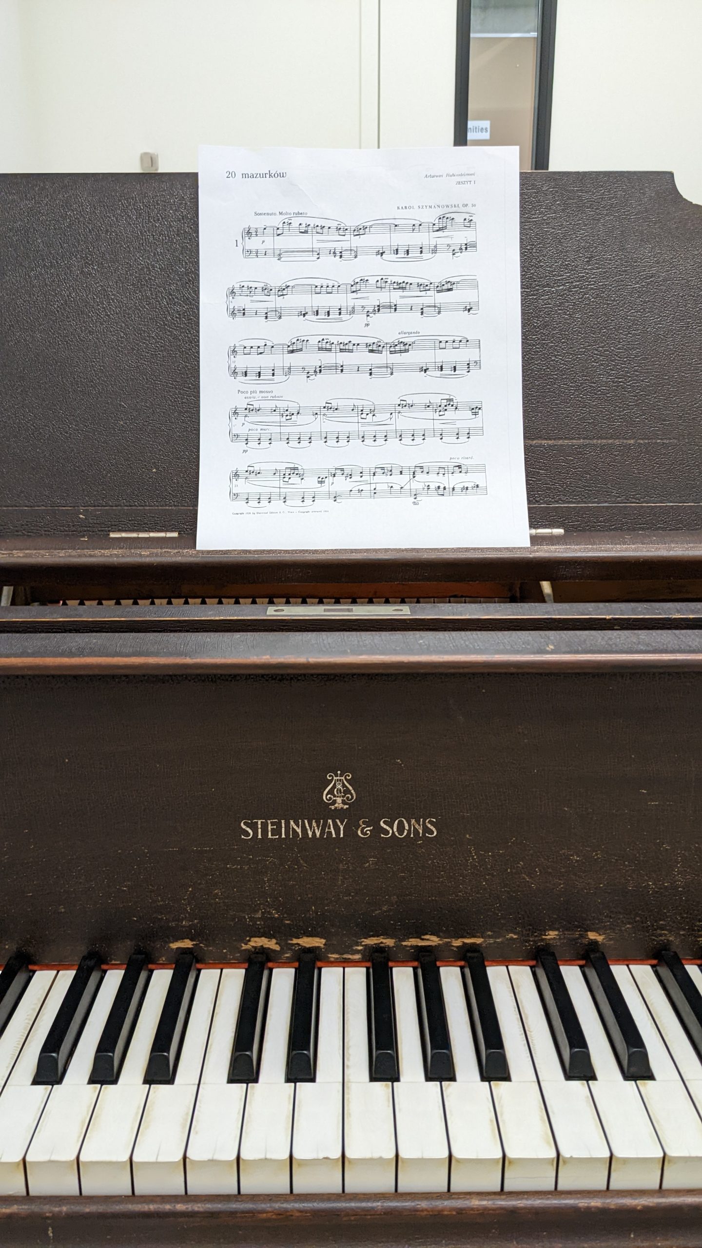 Piano with sheet music displayed.
