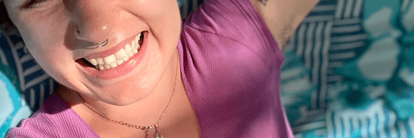 person lying on blanket smiling