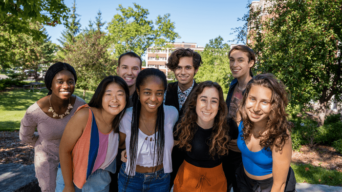 Summer Fellows pose for a picture outside of Scoville Library.