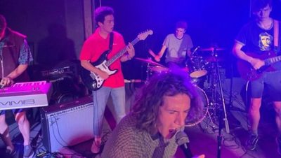 Student rock band performing at the cave