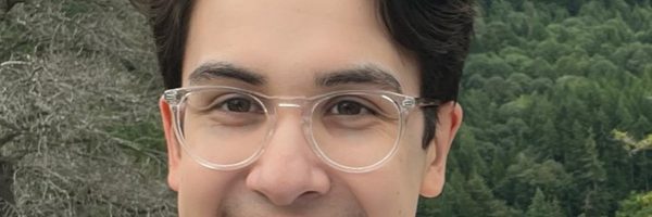 headshot of man with glasses