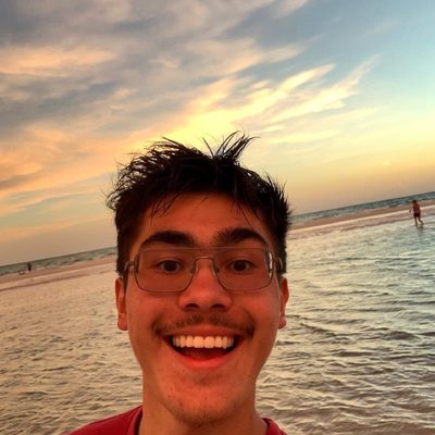 Young man smiling on the beach