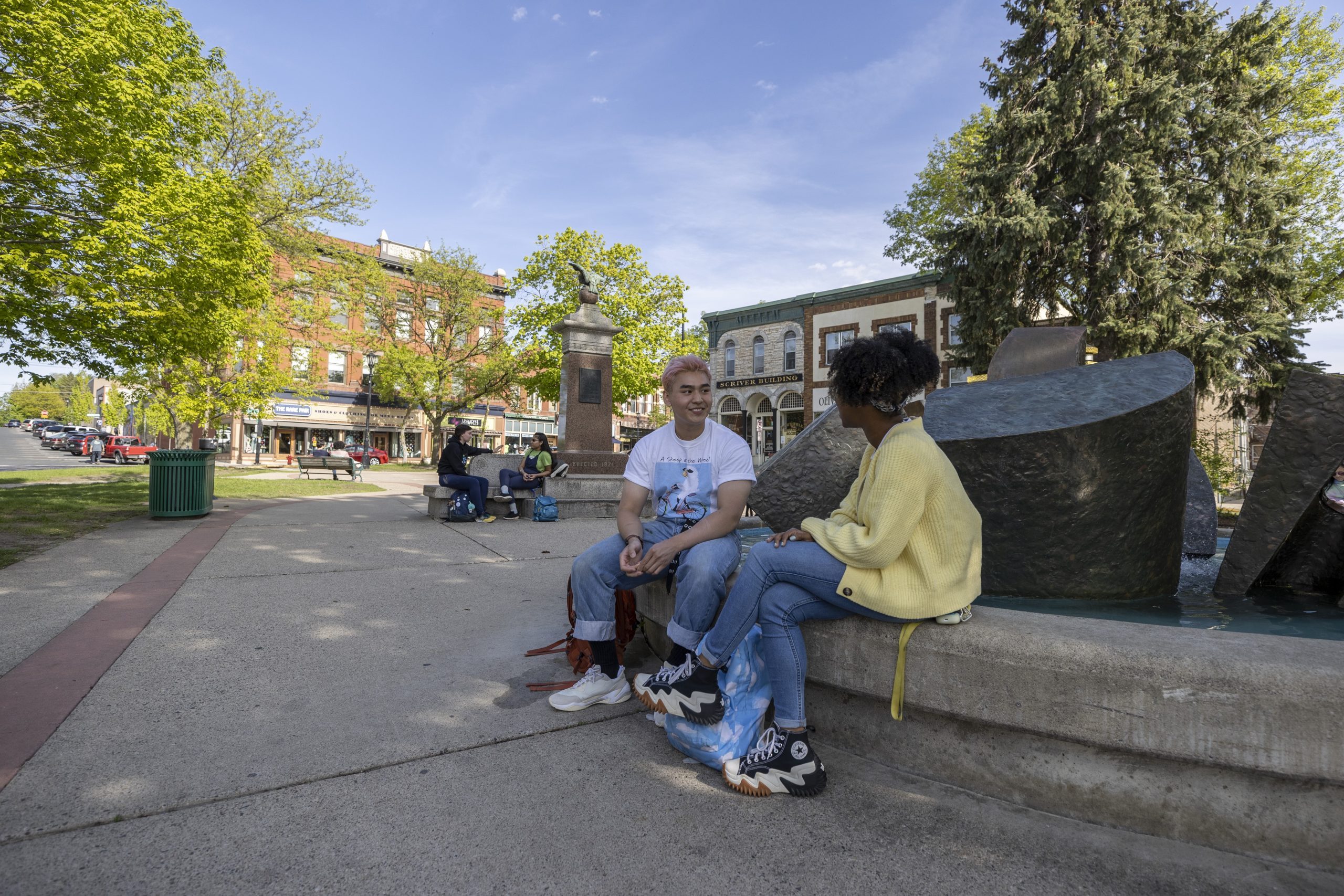 students chatting in a park