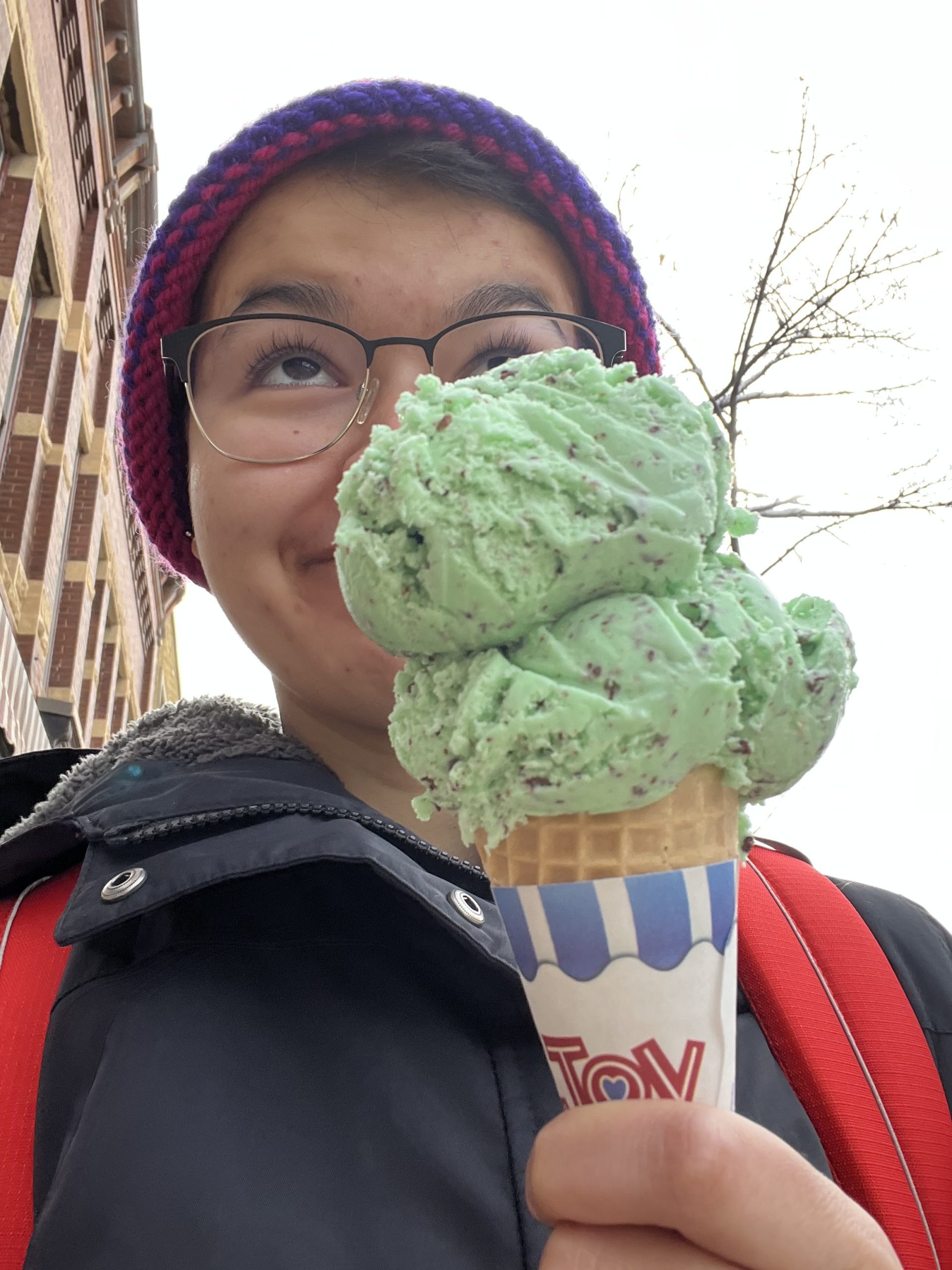 Student with a mint chocolate chip ice cream cone
