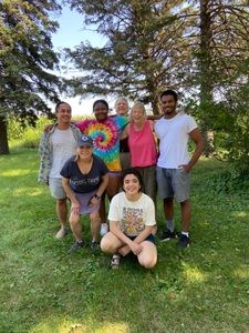 Colorful people and smiley faces pose at the farm.