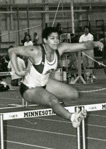 Busola Akinwale leaping a hurdle