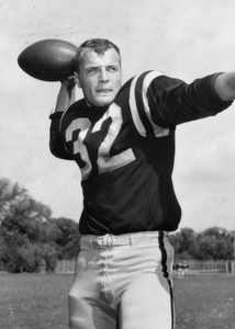 Dave Larson about to throw a football