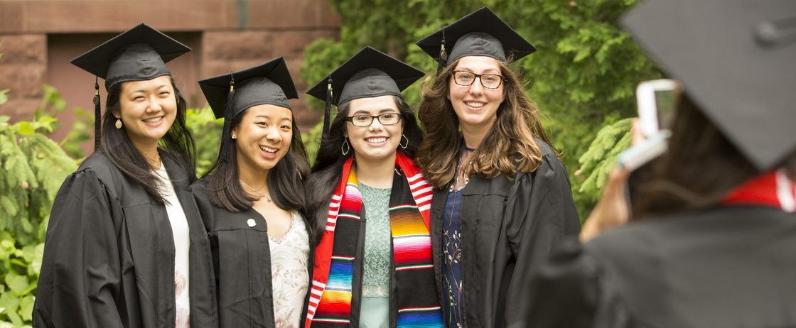 Four graduates at commencement