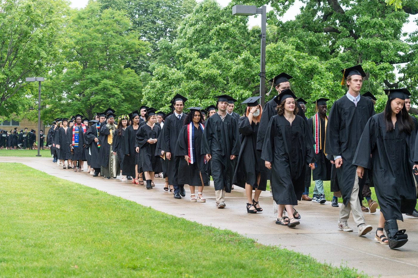 graduating students walking in line to commencement