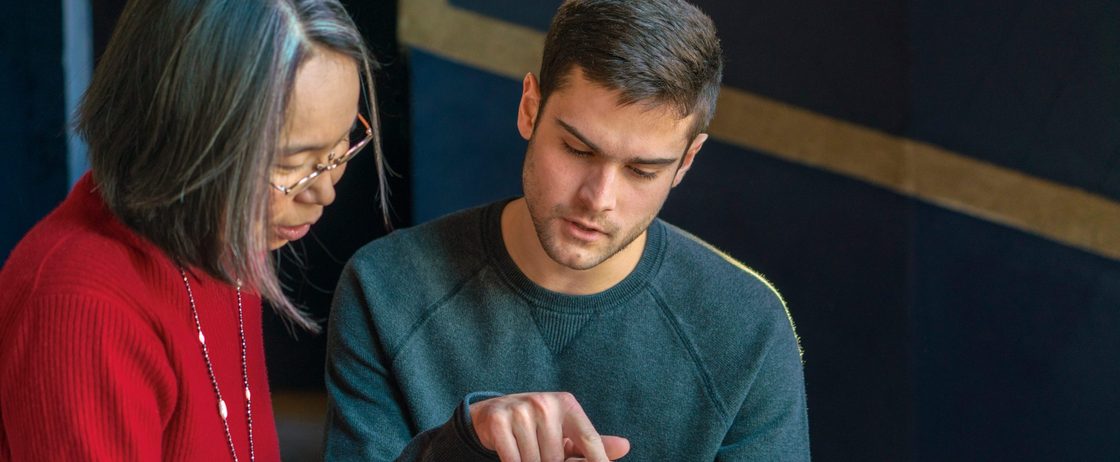 A professor and a student review a reading together