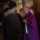Archbishop Flynn greets students after Mass.