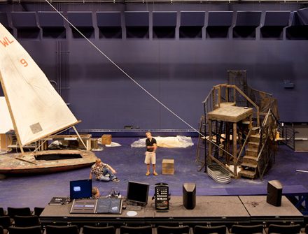 wooden tower and sailboat on the stage of the Black Box Theater
